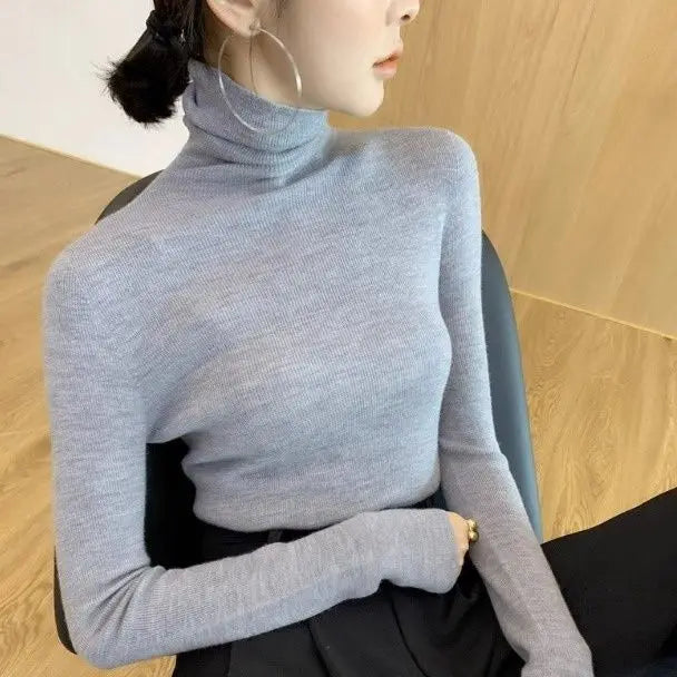 Pull col roulé femme
